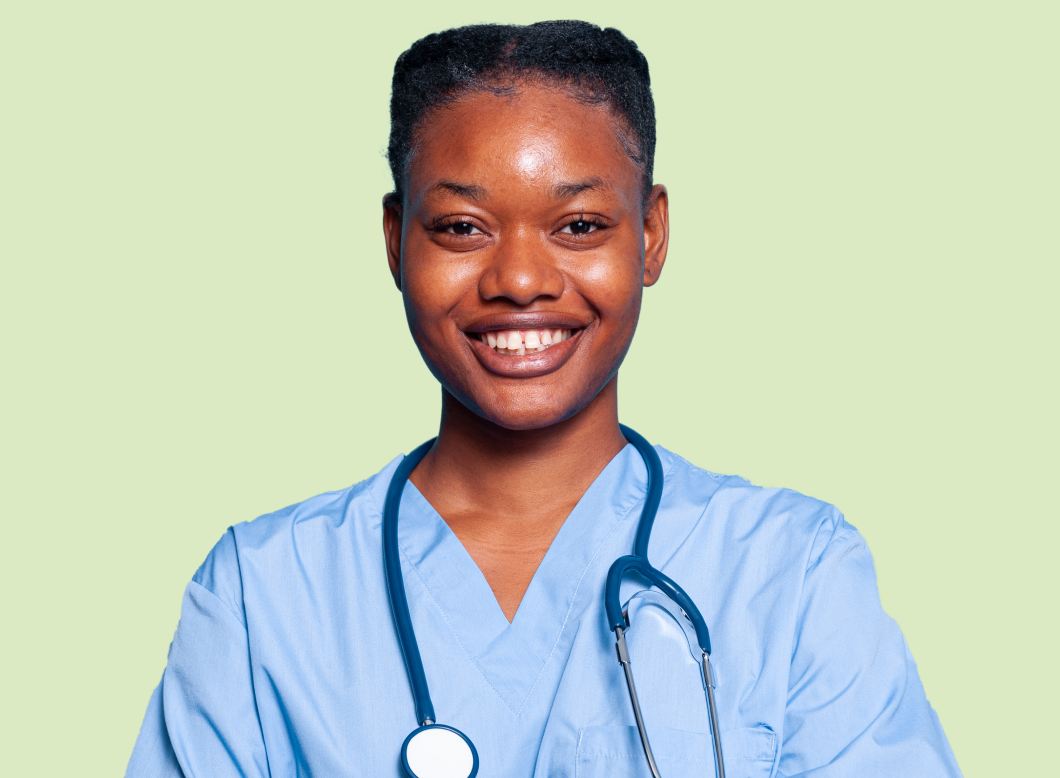 Black woman doctor in blue smiling 